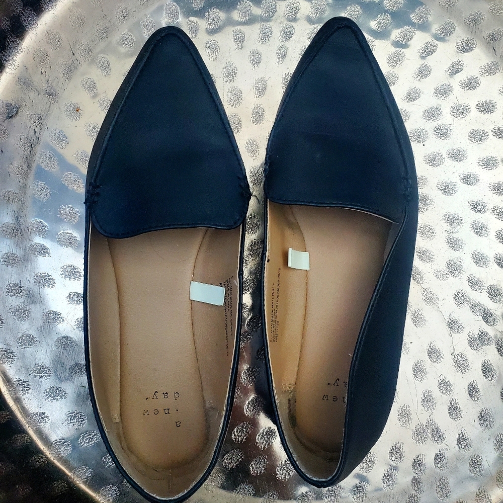 Black leather flats, worn twice